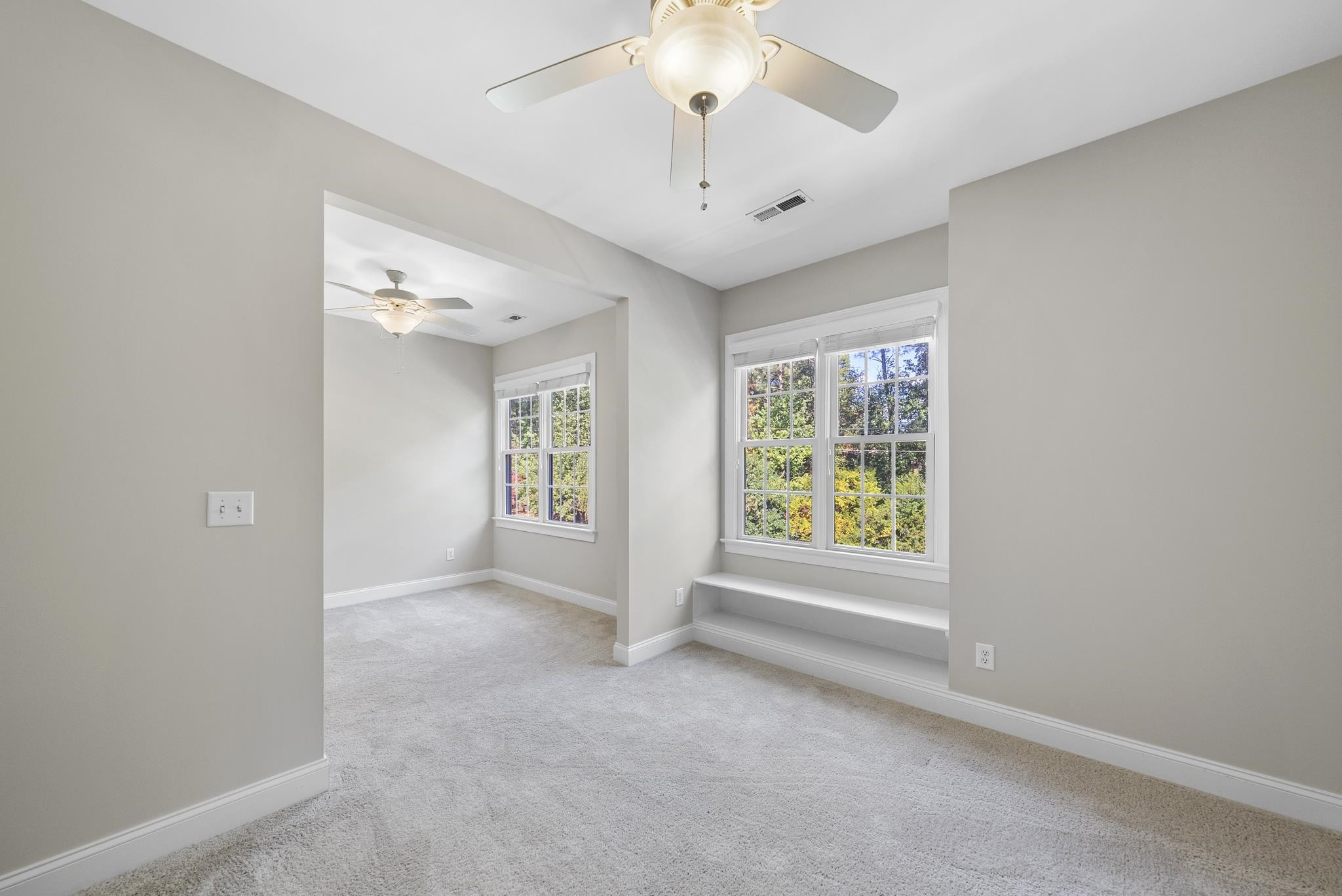 7357 Newport Avenue Raleigh, NC 27613 - Photo 26 of 44 an empty room with windows and entrance
