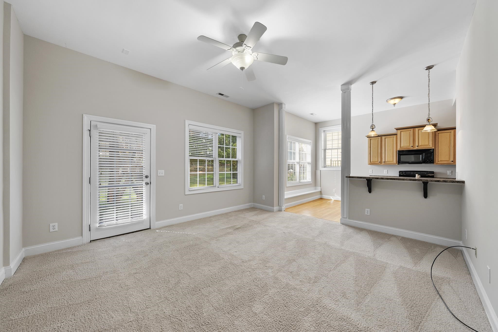 7357 Newport Avenue Raleigh, NC 27613 - Photo 34 of 44 a view of an empty room with a kitchen