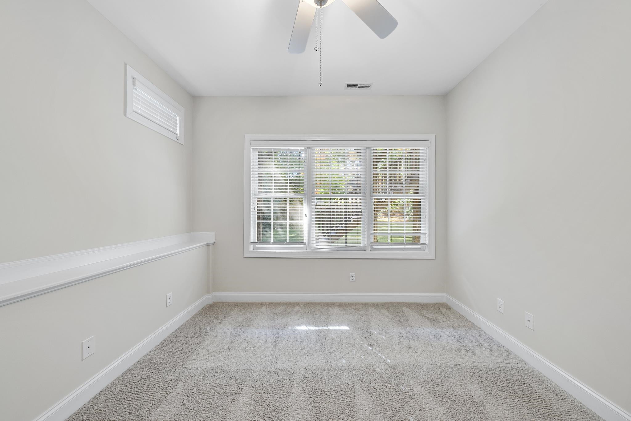 7357 Newport Avenue Raleigh, NC 27613 - Photo 39 of 44 an empty room with a window