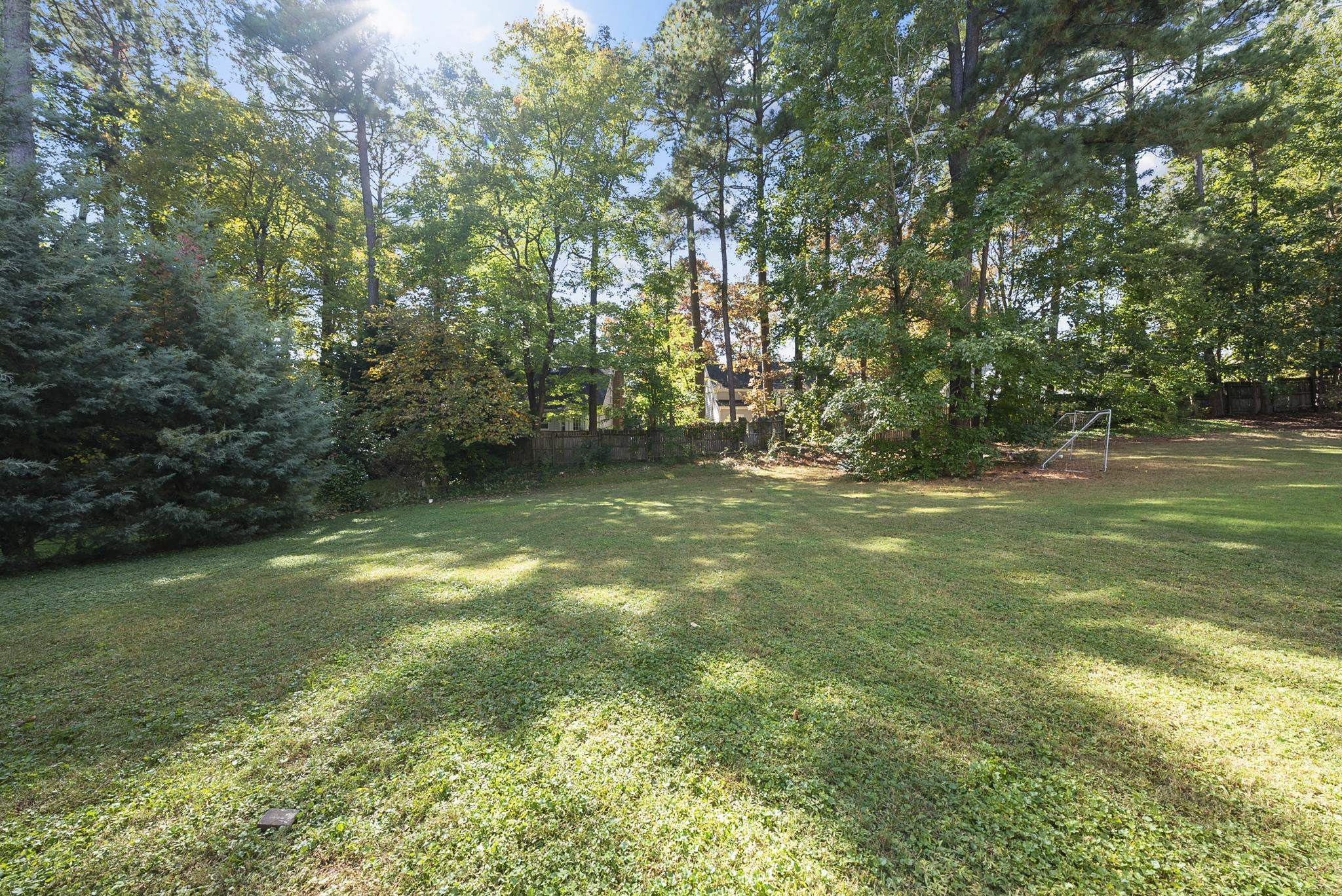 7357 Newport Avenue Raleigh, NC 27613 - Photo 42 of 44 a view of outdoor space and a yard
