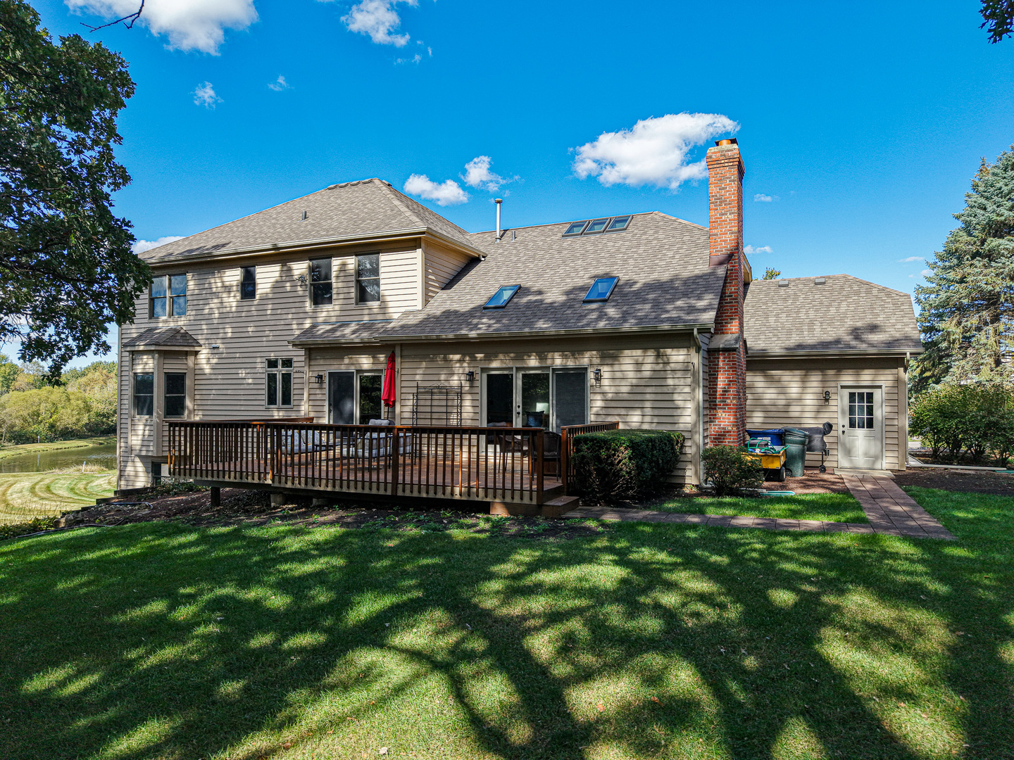 6N679 Colonel Bennett Lane St. Charles, IL 60175 - Photo 22 of 38 a front view of a house with a yard table and chairs
