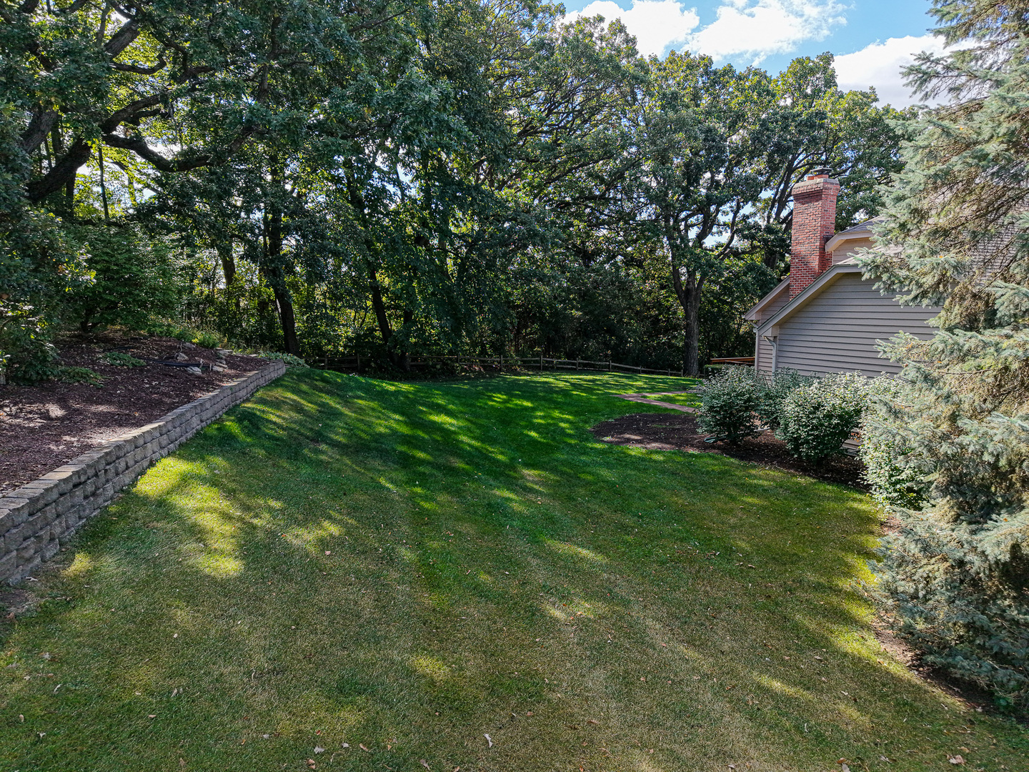 6N679 Colonel Bennett Lane St. Charles, IL 60175 - Photo 32 of 38 a view of a backyard with a garden