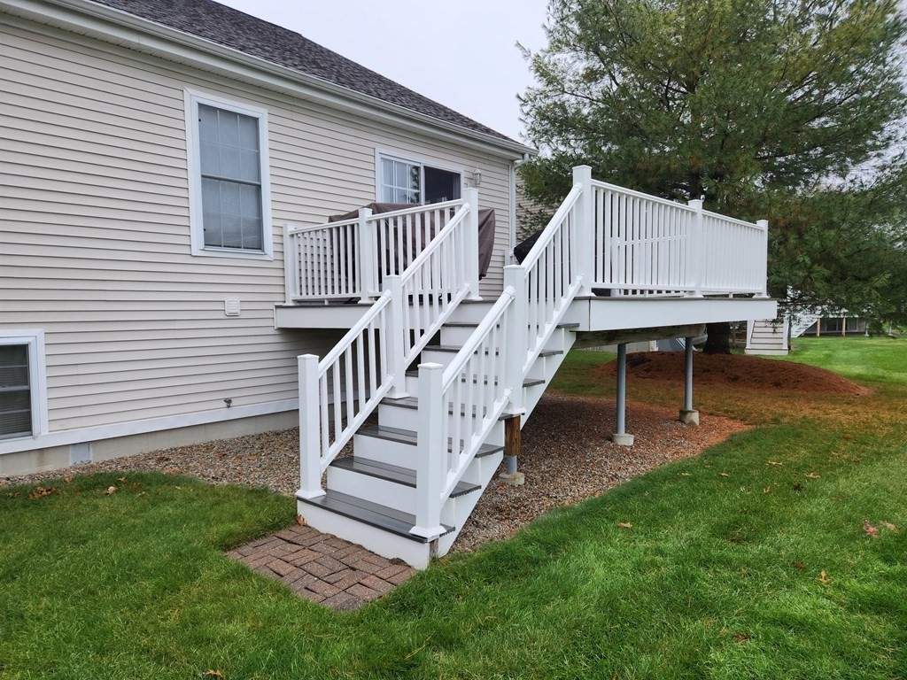 20 Augusta Way, Unit 20 Chelmsford, MA 01863 - Photo 2 of 11 a view of house with backyard and outdoor seating