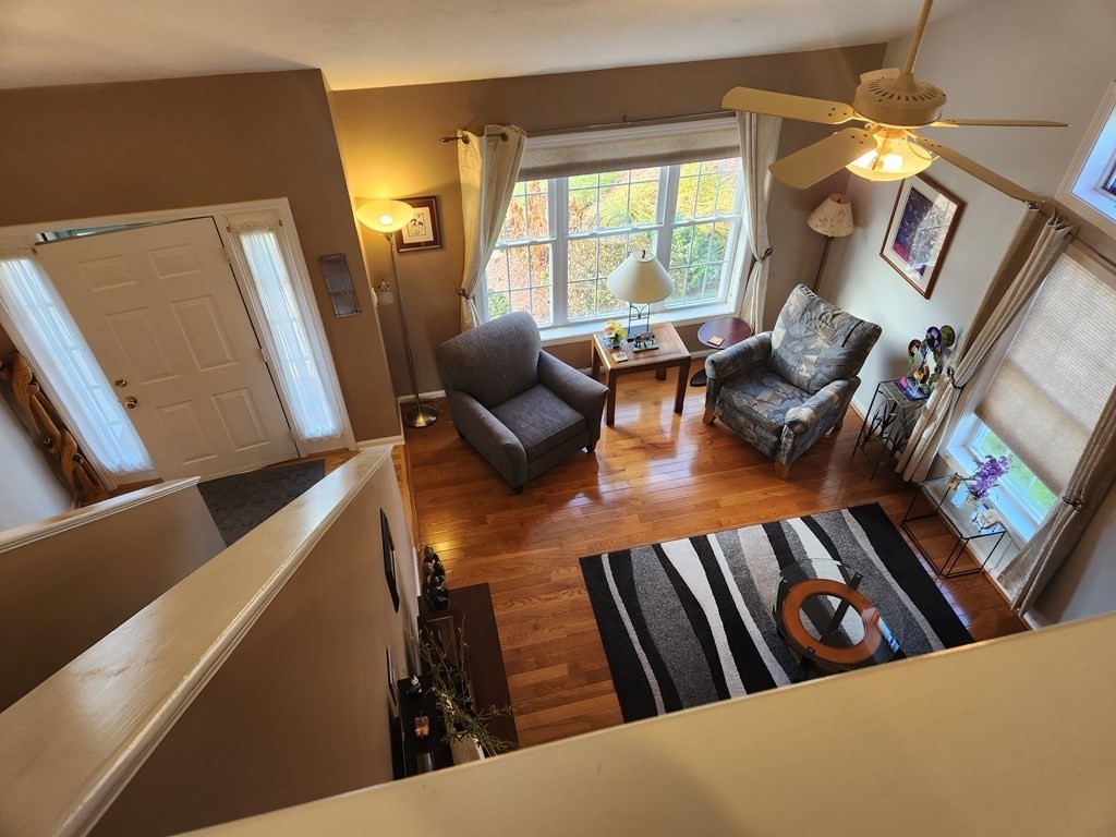 20 Augusta Way, Unit 20 Chelmsford, MA 01863 - Photo 3 of 11 a living room with furniture and a fireplace