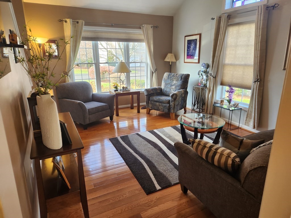 20 Augusta Way, Unit 20 Chelmsford, MA 01863 - Photo 4 of 11 a living room with furniture and a large window