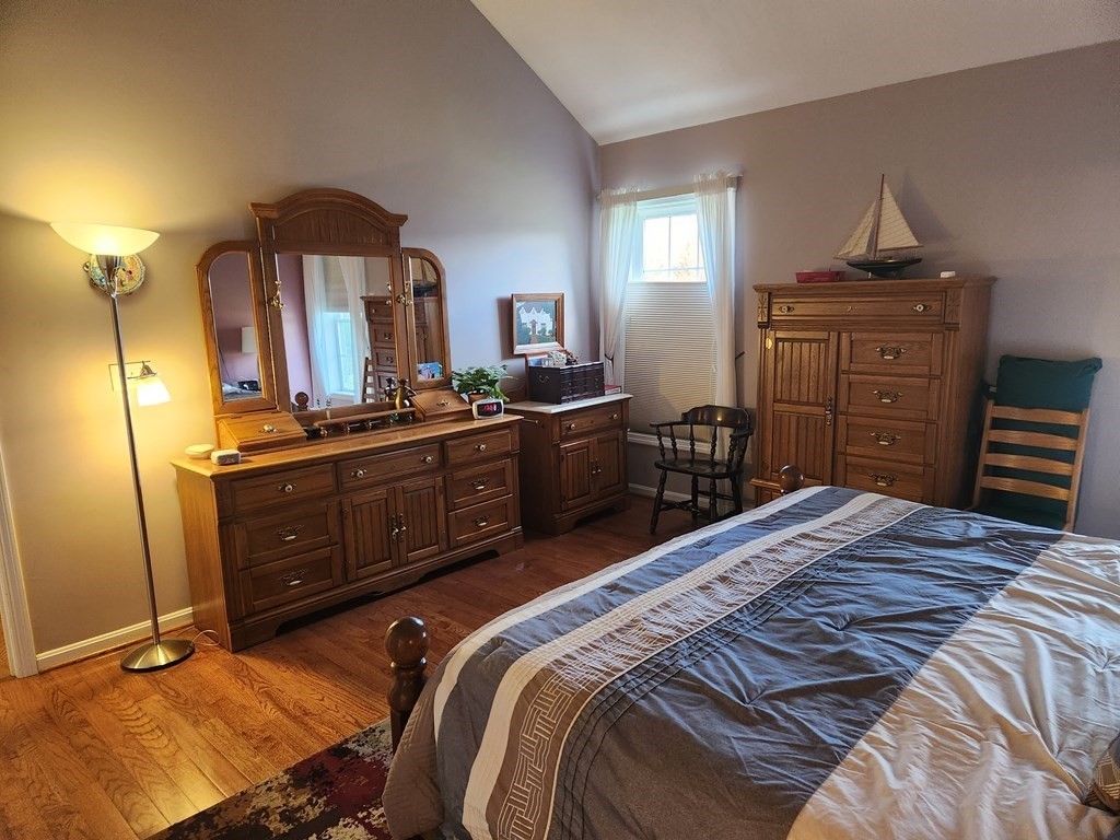 20 Augusta Way, Unit 20 Chelmsford, MA 01863 - Photo 9 of 11 a bedroom with a bed and furniture