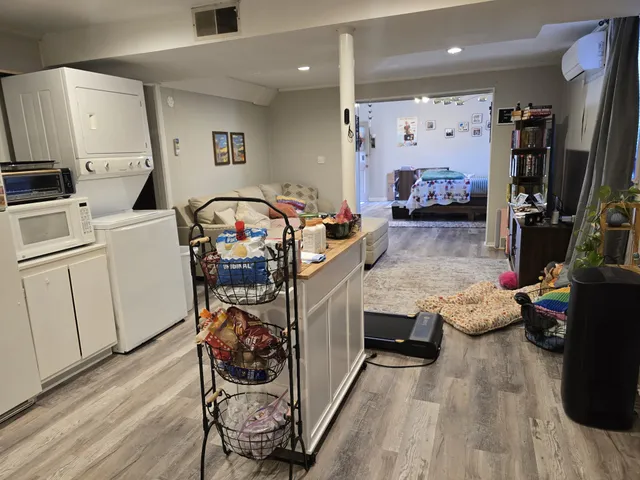 a living room with furniture and flat screen tv