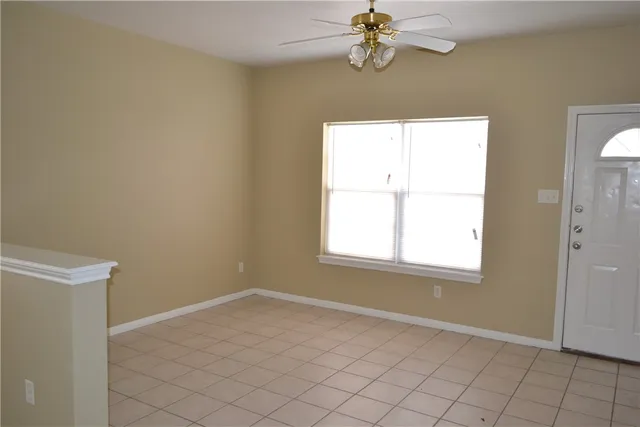 a white toilet sitting next to a bathroom sink and a shower