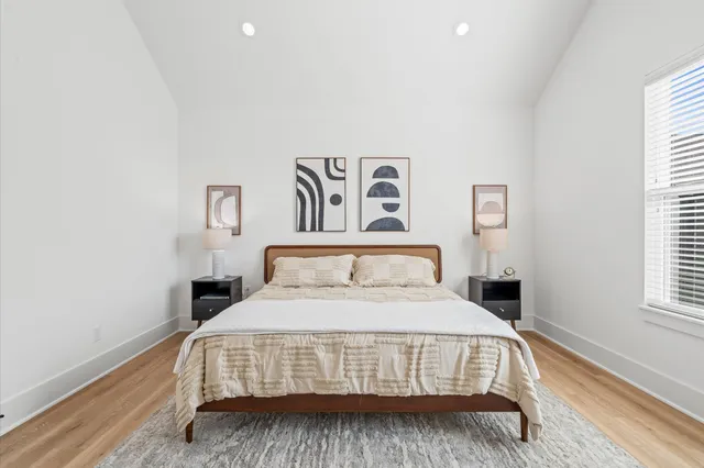 a bedroom with a bed and window