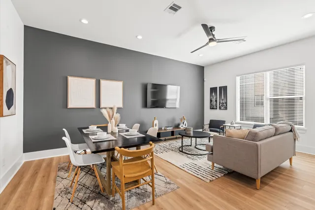 a living room with fireplace furniture and a flat screen tv