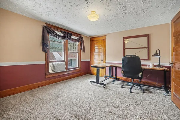a workspace with furniture and a window