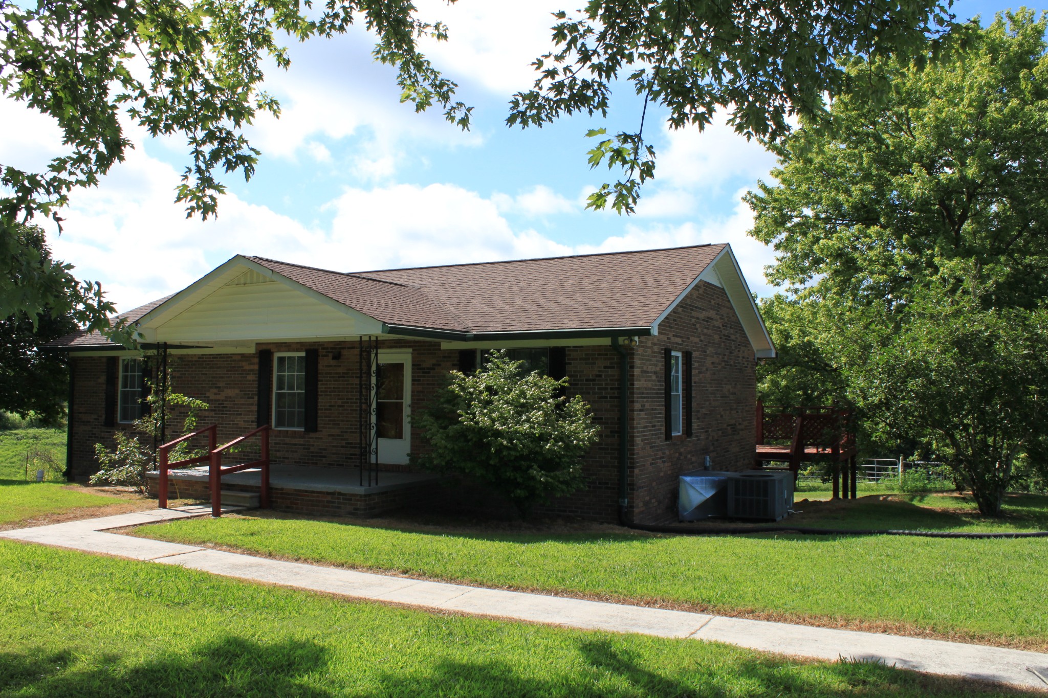 6923 Old Mill Hill Road Dowelltown, TN 37059 - Photo 12 of 43 a front view of a house with garden
