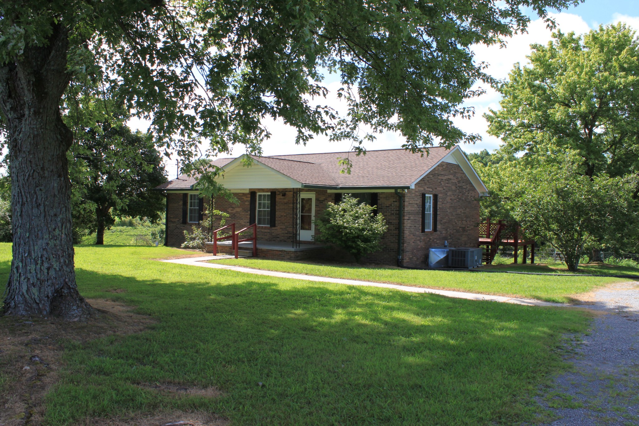 6923 Old Mill Hill Road Dowelltown, TN 37059 - Photo 13 of 43 a front view of a house with swimming pool having outdoor seating