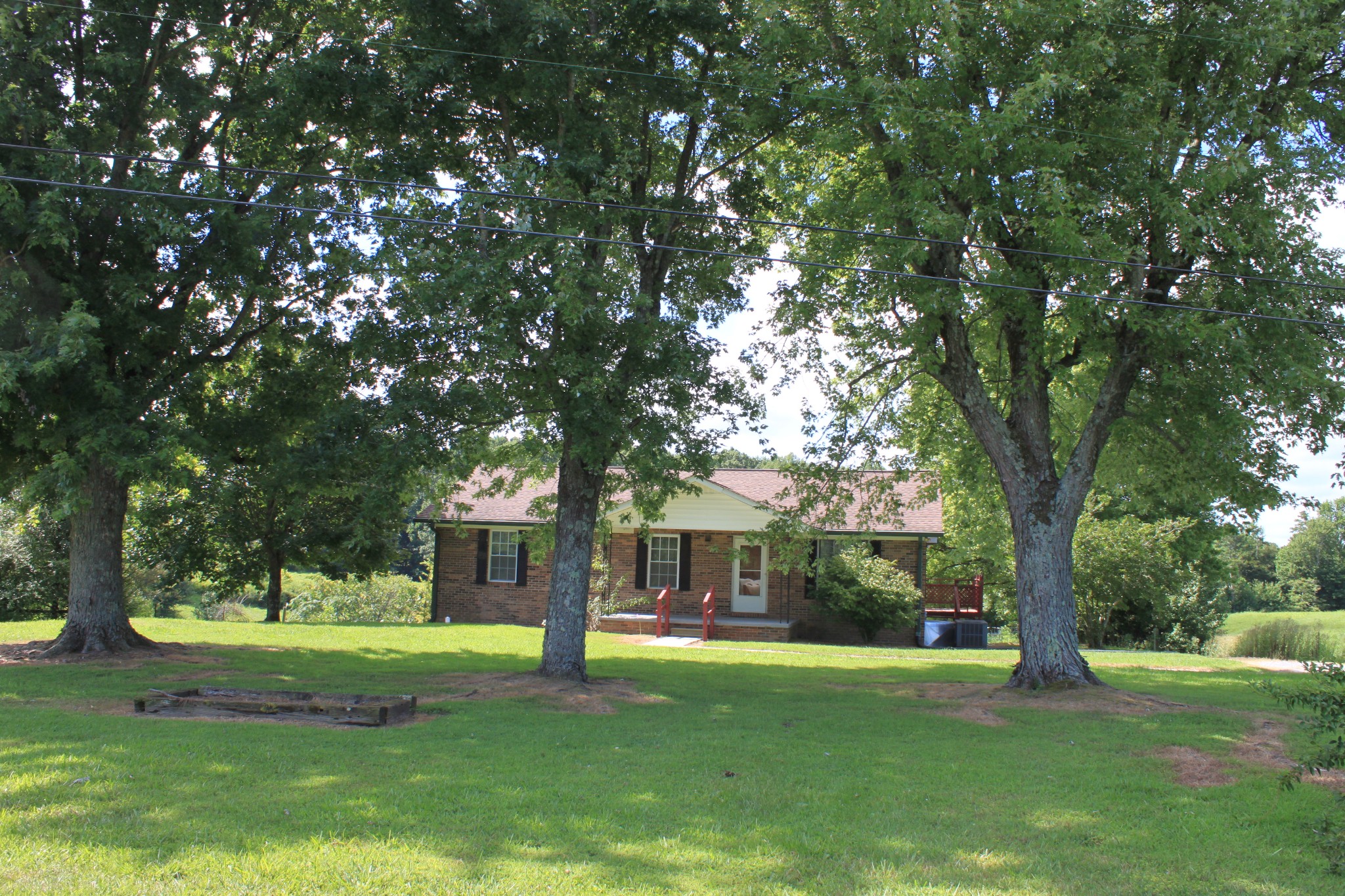 6923 Old Mill Hill Road Dowelltown, TN 37059 - Photo 16 of 43 a view of a house with a yard
