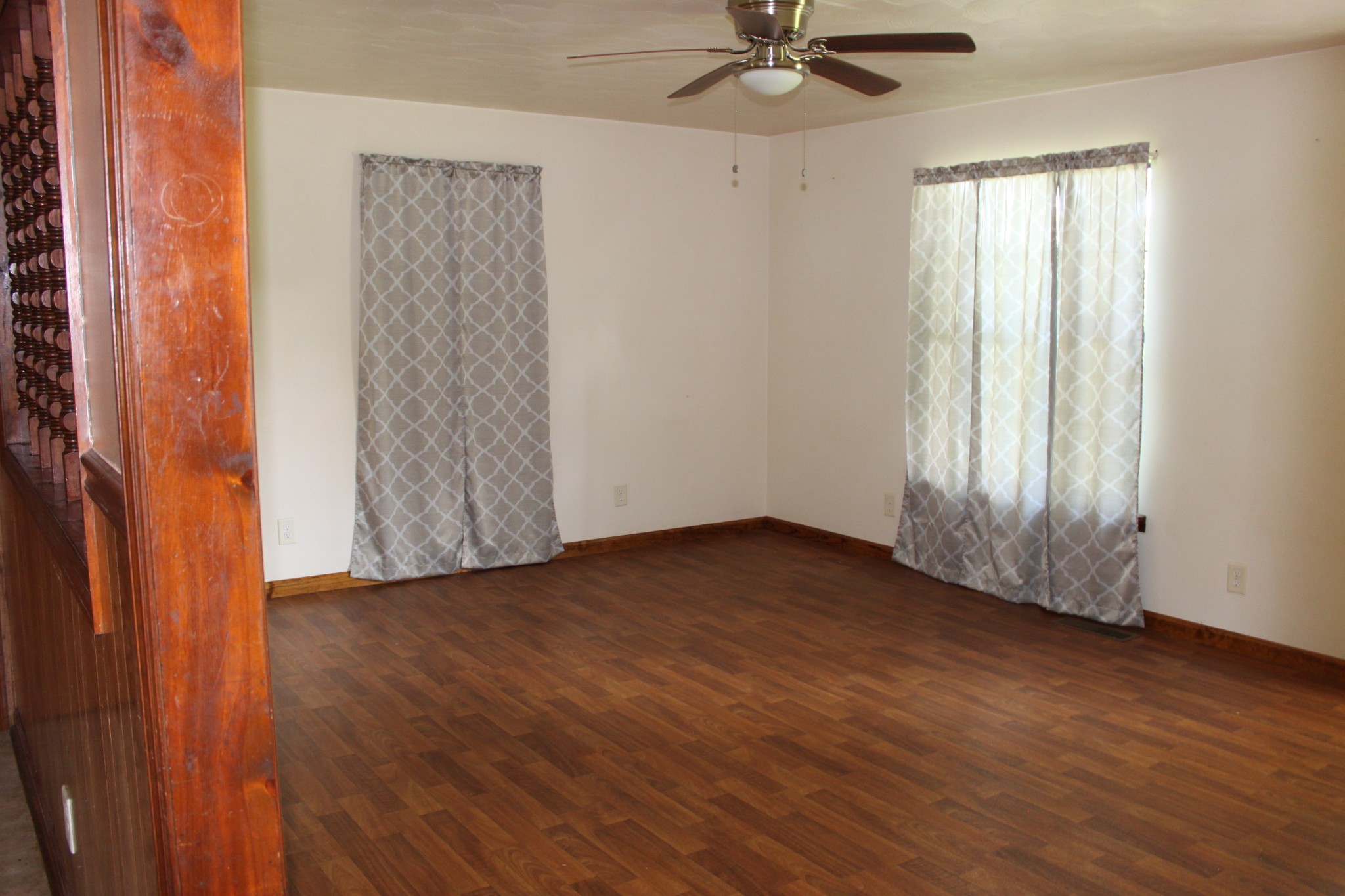 6923 Old Mill Hill Road Dowelltown, TN 37059 - Photo 17 of 43 an empty room with wooden floor fan and windows