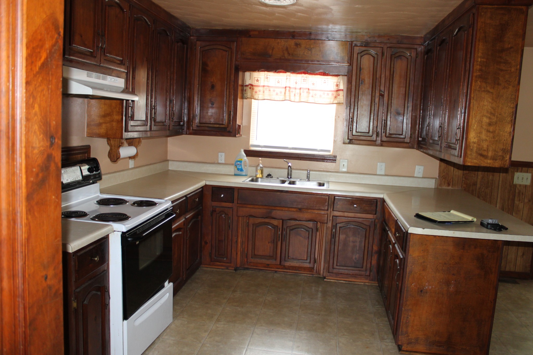 6923 Old Mill Hill Road Dowelltown, TN 37059 - Photo 19 of 43 a kitchen with a sink stove top oven and cabinets