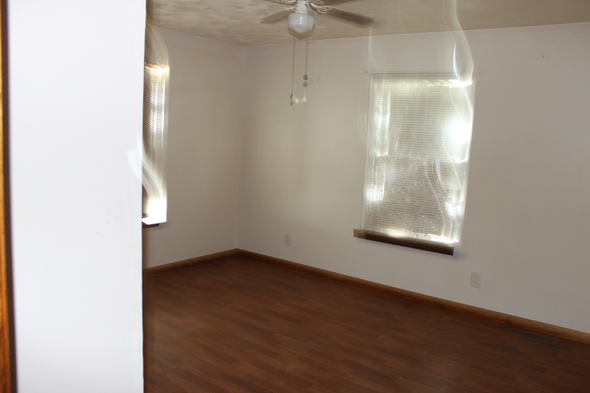 6923 Old Mill Hill Road Dowelltown, TN 37059 - Photo 27 of 43 an empty room with wooden floor and windows