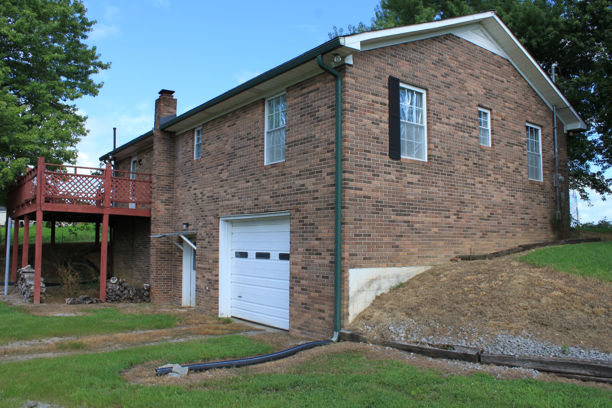 6923 Old Mill Hill Road Dowelltown, TN 37059 - Photo 4 of 43 a front view of a house with a yard