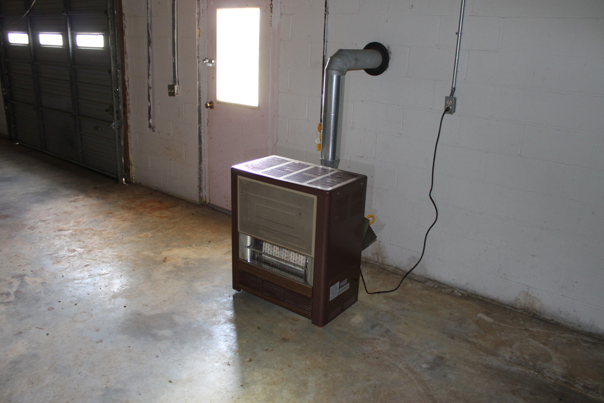 6923 Old Mill Hill Road Dowelltown, TN 37059 - Photo 41 of 43 a room with water heater and a wooden door