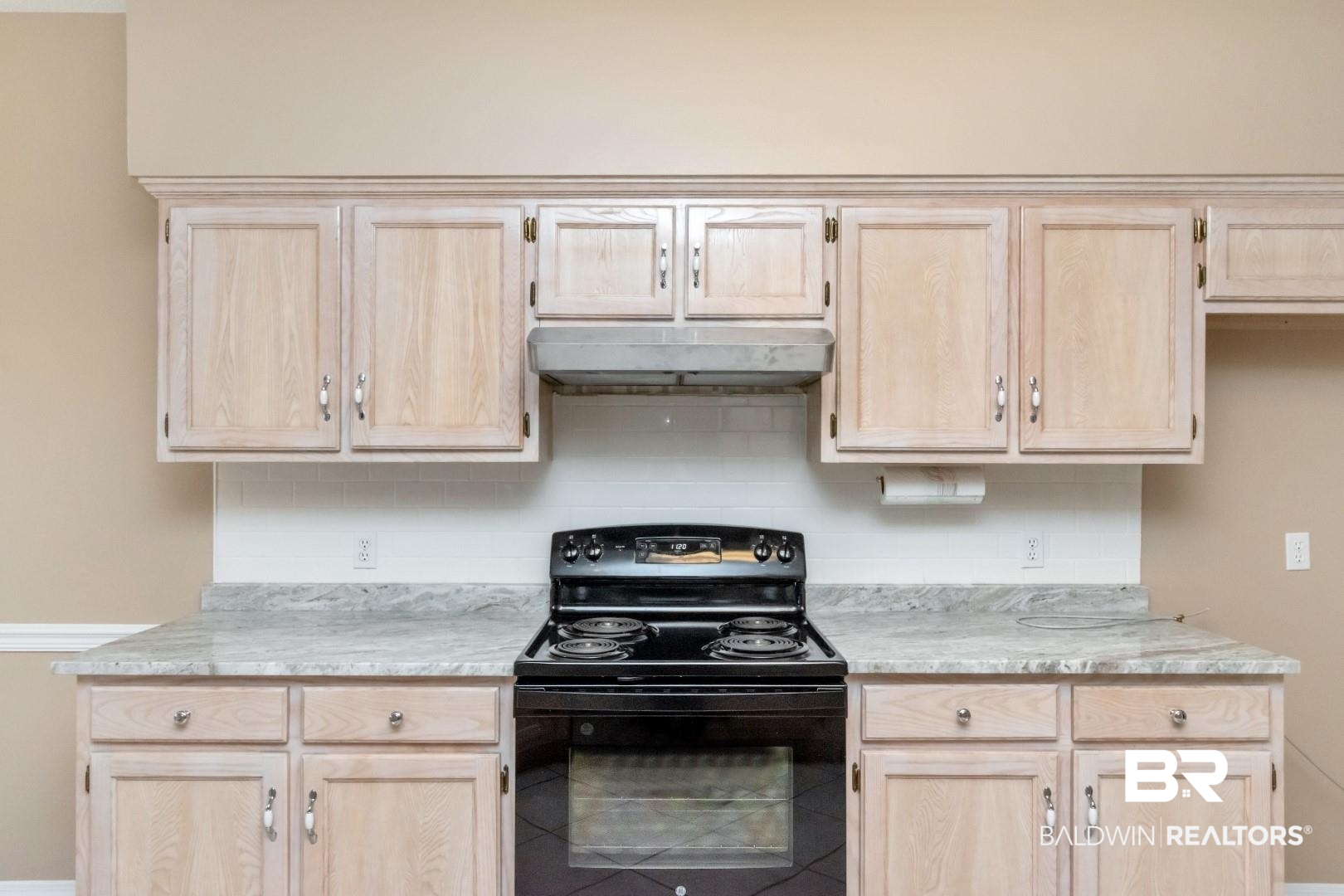 6117 Lennox Place Mobile, AL 36693 - Photo 16 of 39 Kitchen featuring under cabinet range hood, black electric range oven, and light brown cabinets