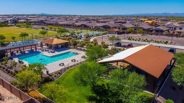 an aerial view of residential houses with outdoor space