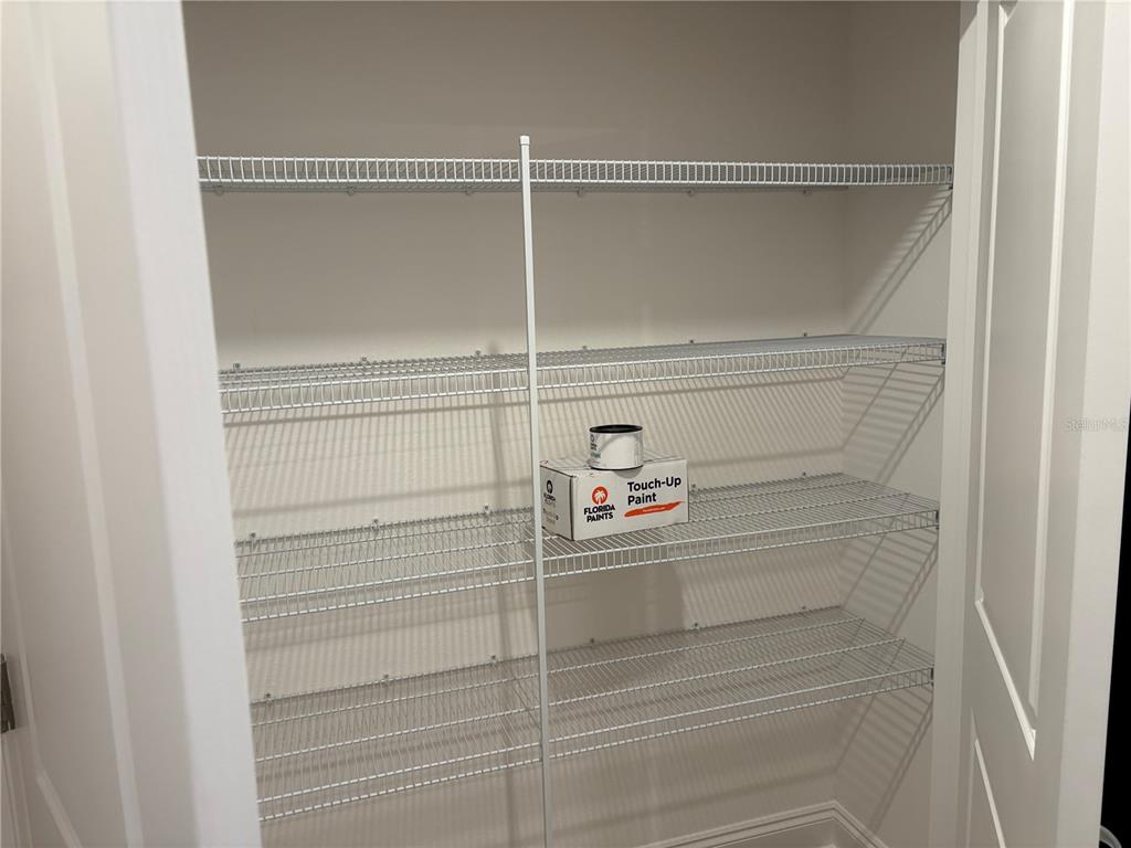 48 Enclave Avenue Palm Coast, FL 32164 - Photo 13 of 20 a view of walk in closet with empty racks