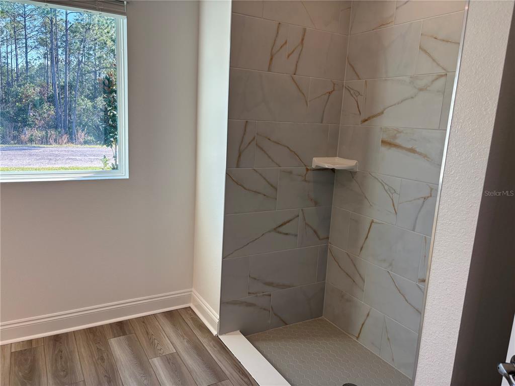 48 Enclave Avenue Palm Coast, FL 32164 - Photo 8 of 20 a bathroom with a window