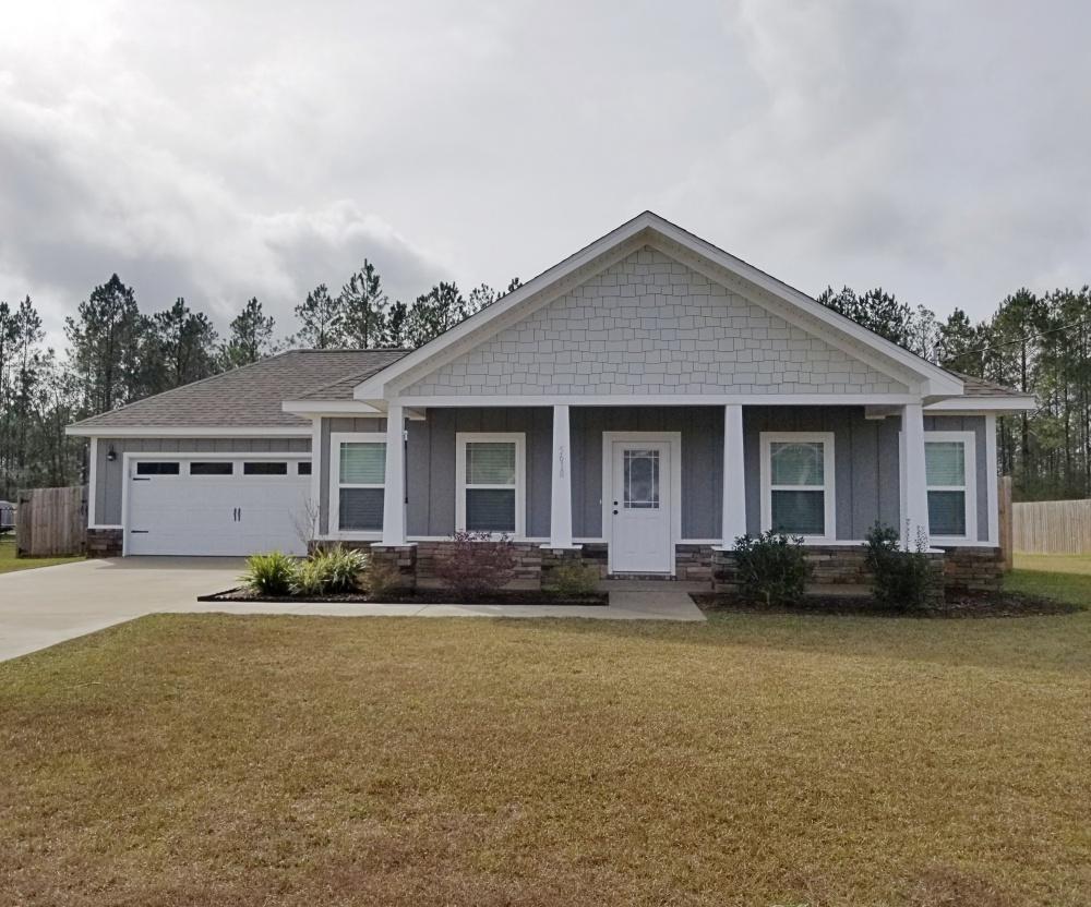 5618 Price Plantation Road Baker, FL 32531 - Photo 2 of 24 a front view of house with yard and green space
