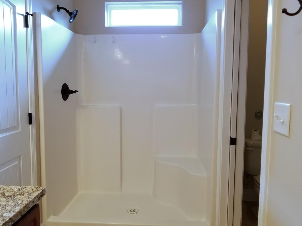 5618 Price Plantation Road Baker, FL 32531 - Photo 18 of 24 a bathroom with a shower