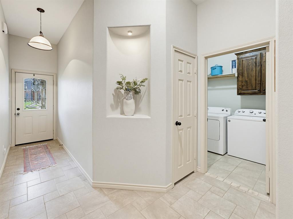 2108 Ridgewood Drive Bridgeport, TX 76426 - Photo 8 of 35 Tiled flooring extending throughout the entryway and laundry area