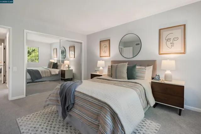 a bedroom with bed and a chandelier