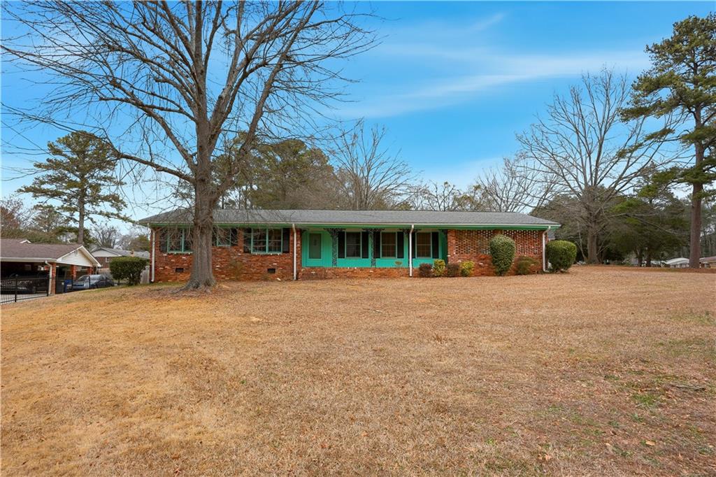 2935 Heather Drive East Point, GA 30344 - Photo 1 of 25 a front view of house with yard space and green space