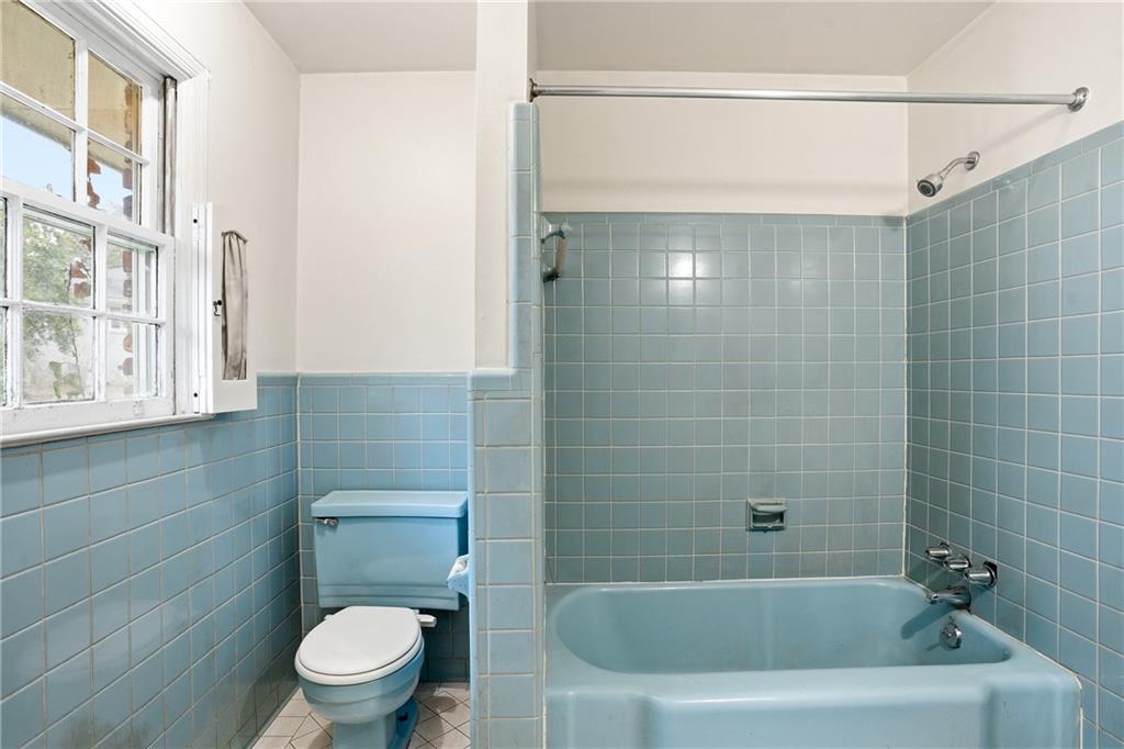 2935 Heather Drive East Point, GA 30344 - Photo 12 of 25 a bathroom with a shower a toilet and a bathtub