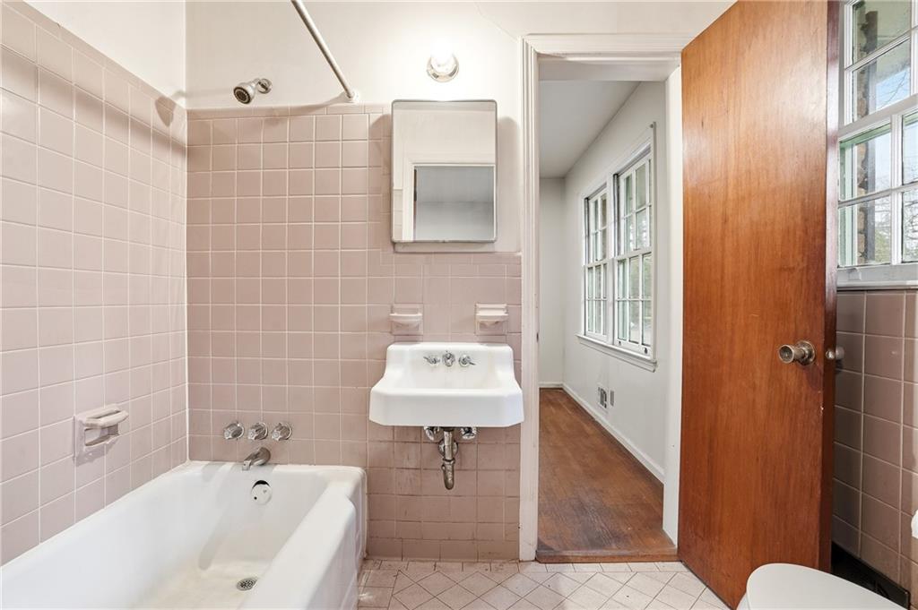 2935 Heather Drive East Point, GA 30344 - Photo 21 of 25 a bathroom with a sink a toilet and shower