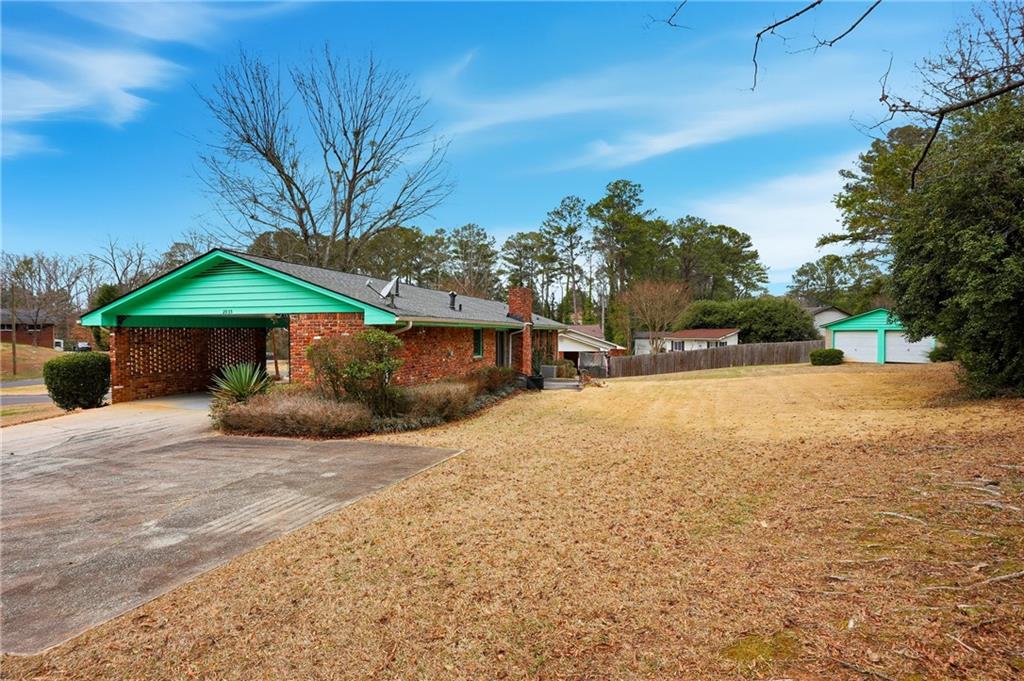 2935 Heather Drive East Point, GA 30344 - Photo 24 of 25 a view of a house with a yard