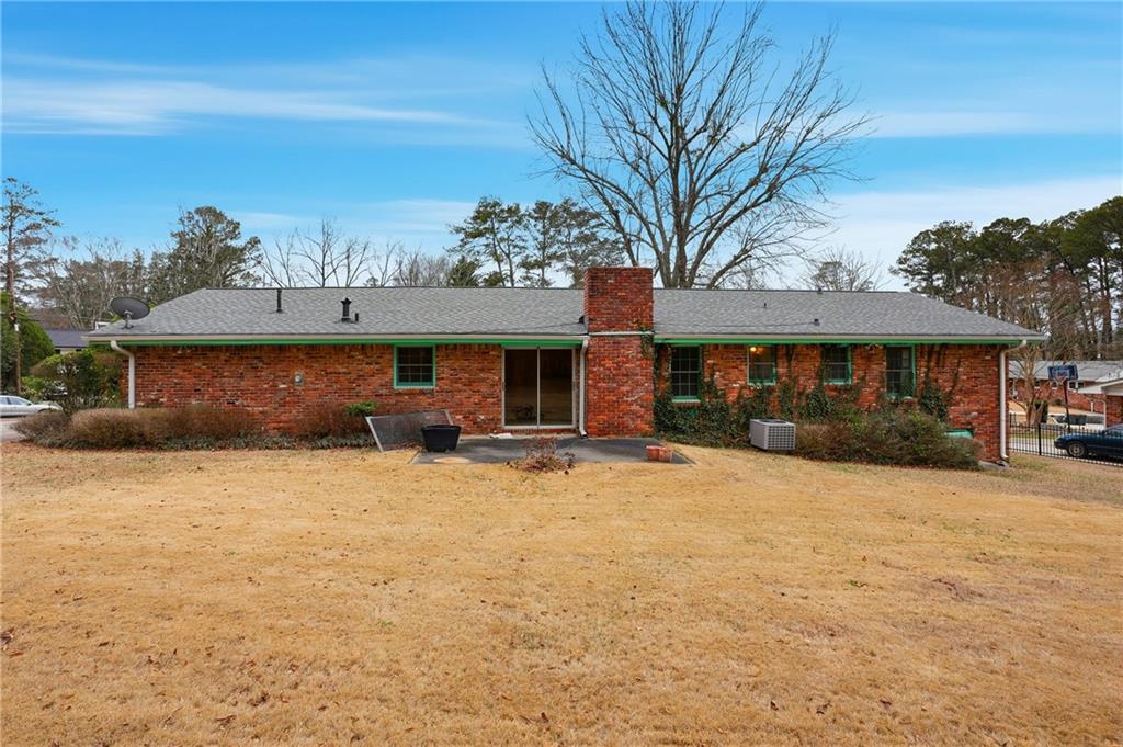 2935 Heather Drive East Point, GA 30344 - Photo 25 of 25 a front view of a house with a yard