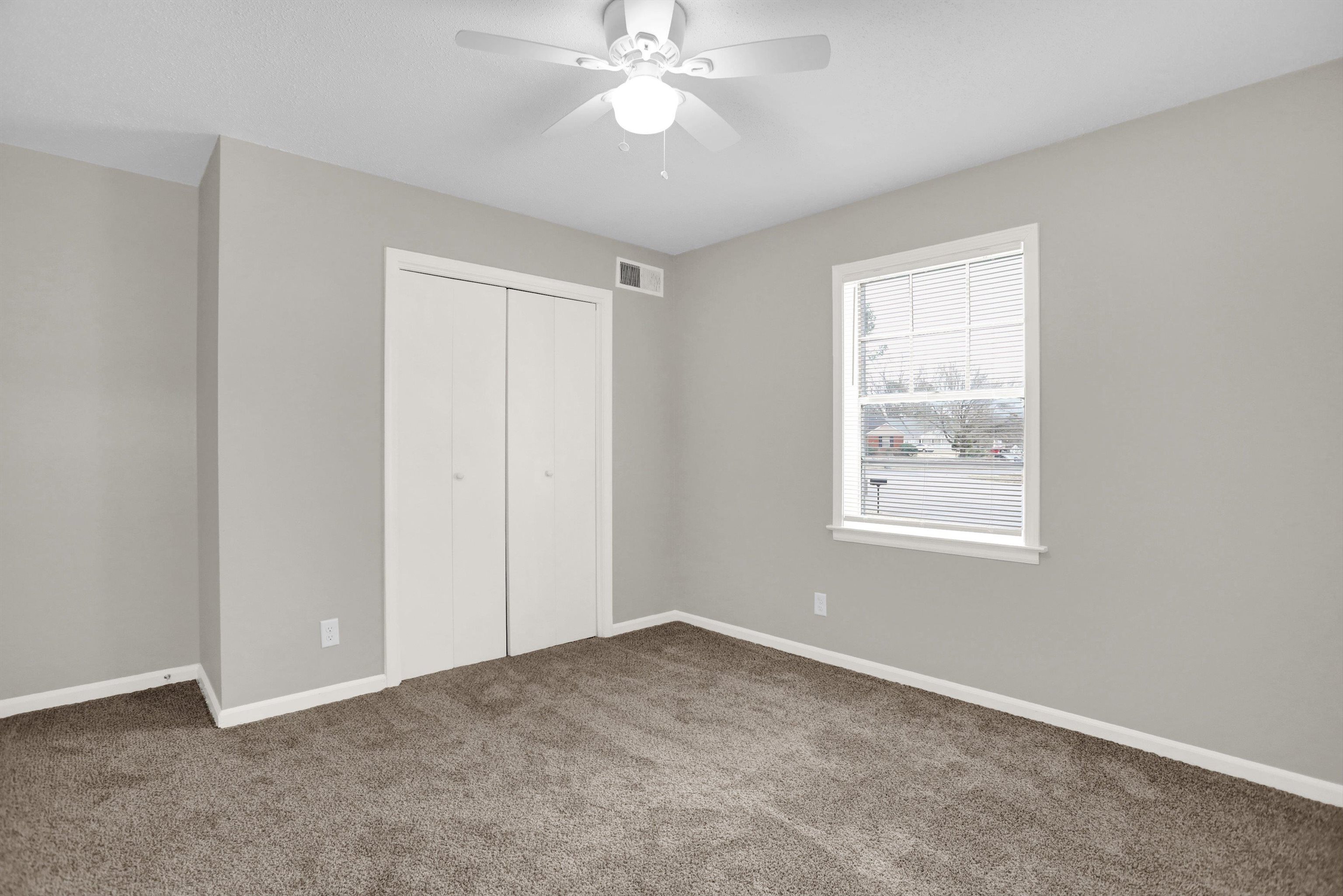 2853 Clearbrook Street Memphis, TN 38118 - Photo 20 of 30 Unfurnished bedroom featuring carpet floors, a closet, visible vents, a ceiling fan, and baseboards