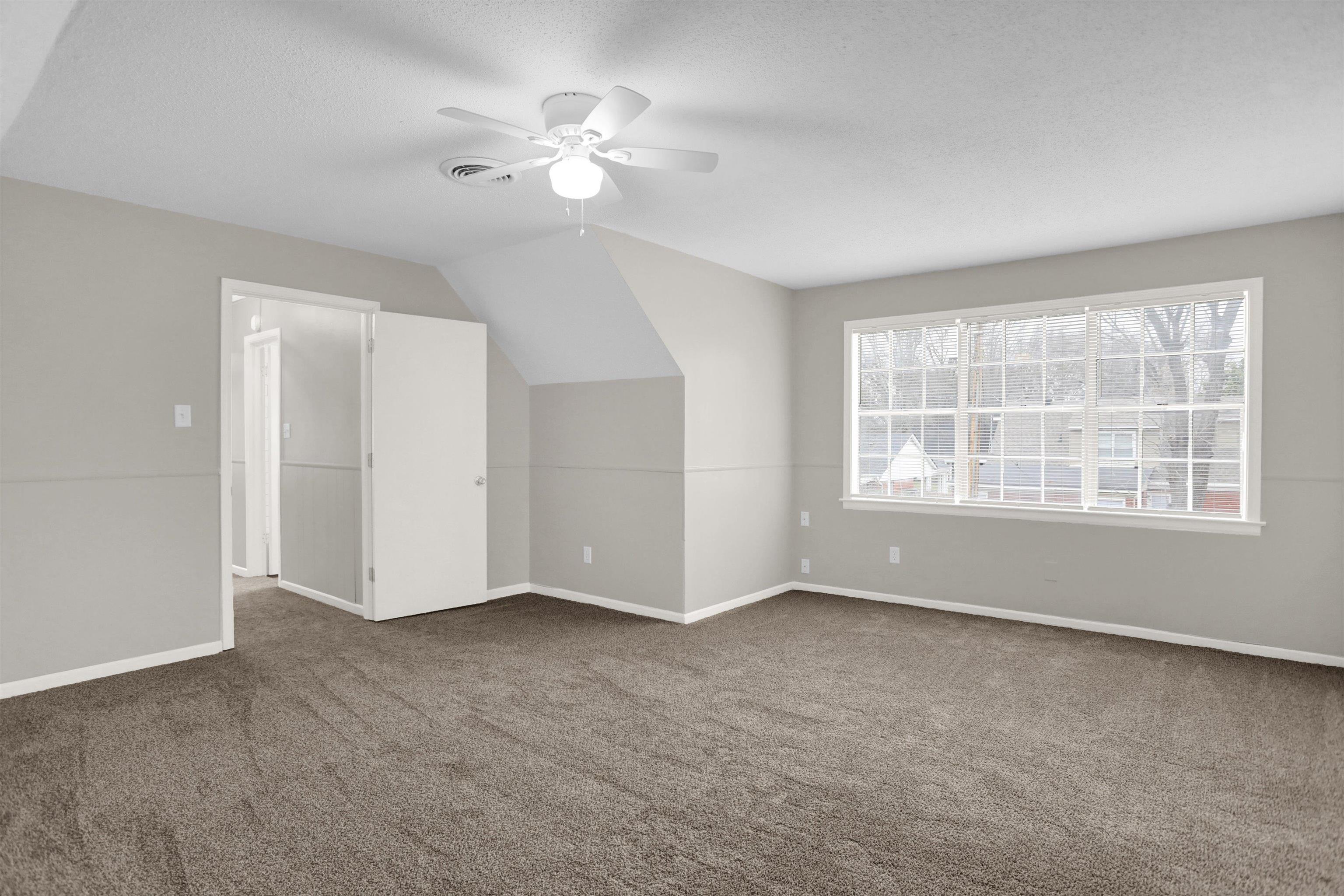 2853 Clearbrook Street Memphis, TN 38118 - Photo 26 of 30 Bonus room featuring carpet floors, visible vents, a ceiling fan, vaulted ceiling, and a textured ceiling