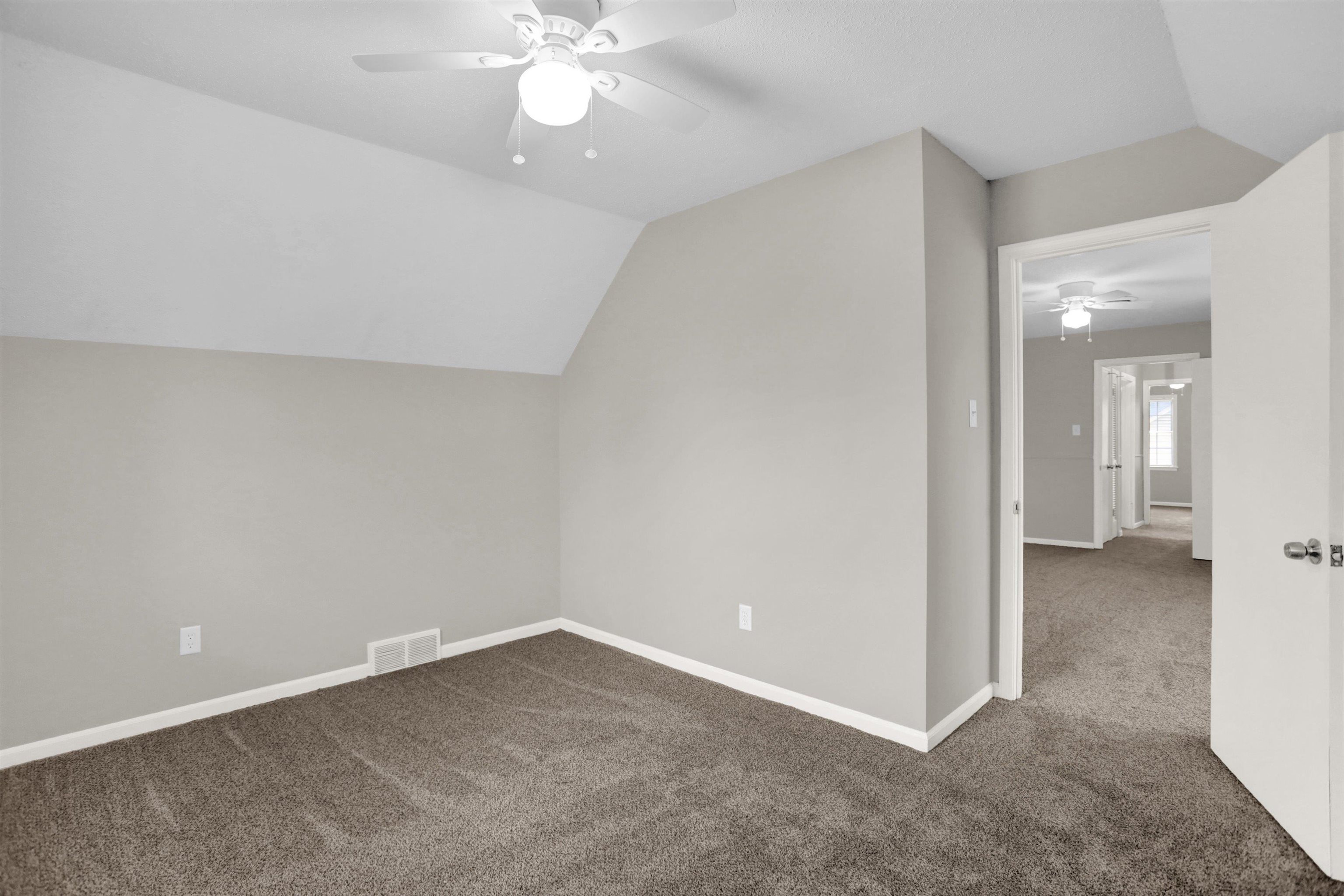 2853 Clearbrook Street Memphis, TN 38118 - Photo 29 of 30 Bonus room featuring carpet floors, baseboards, visible vents, and vaulted ceiling