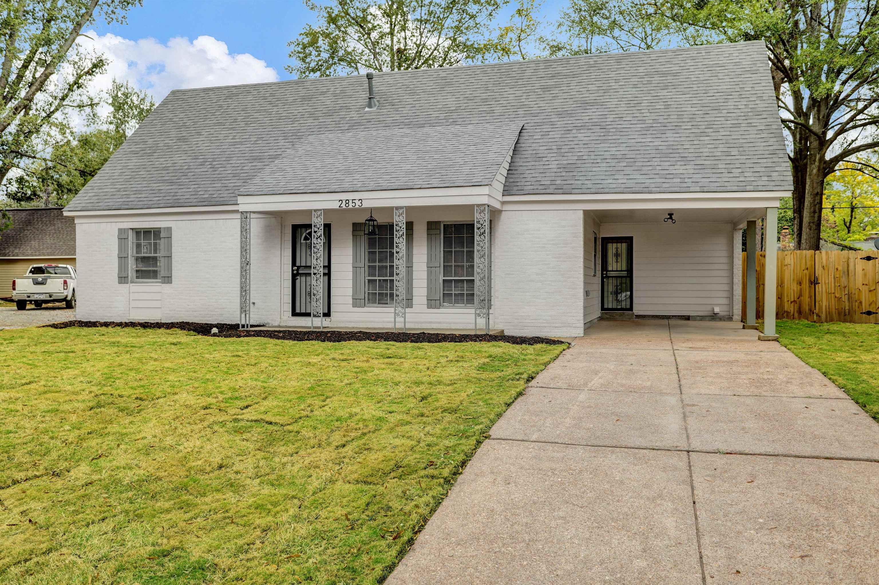 2853 Clearbrook Street Memphis, TN 38118 - Photo 3 of 30 View of front of property featuring concrete driveway, brick siding, a front yard, and a shingled roof