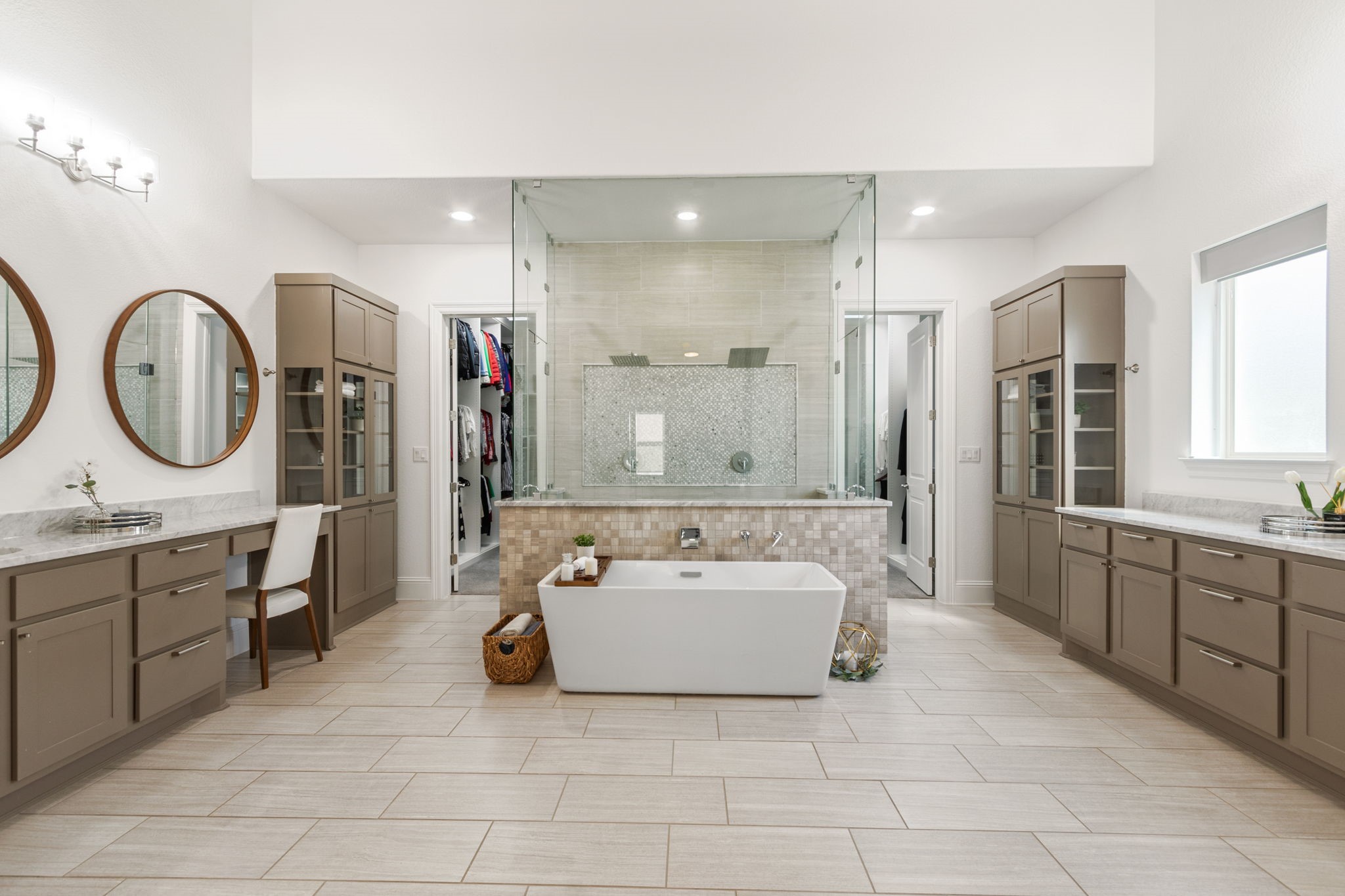 28518 Hoffman Spring Lane Fulshear, TX 77441 - Photo 21 of 50 Breathtaking spa-inspired primary bathroom with dual showers, soaking tub and luxurious finishes.