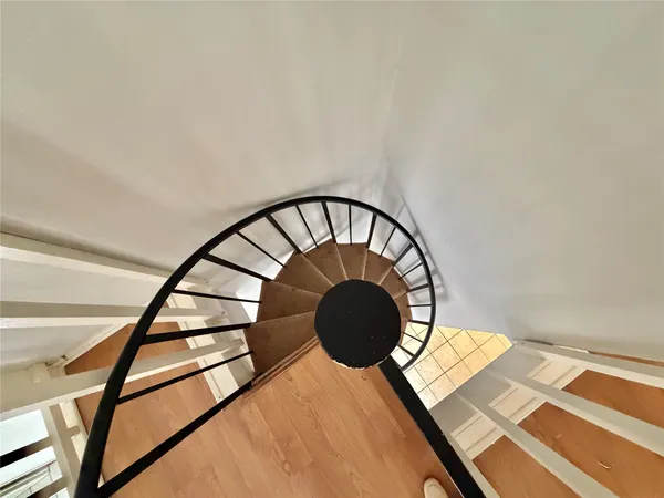 a view of staircase with a rug