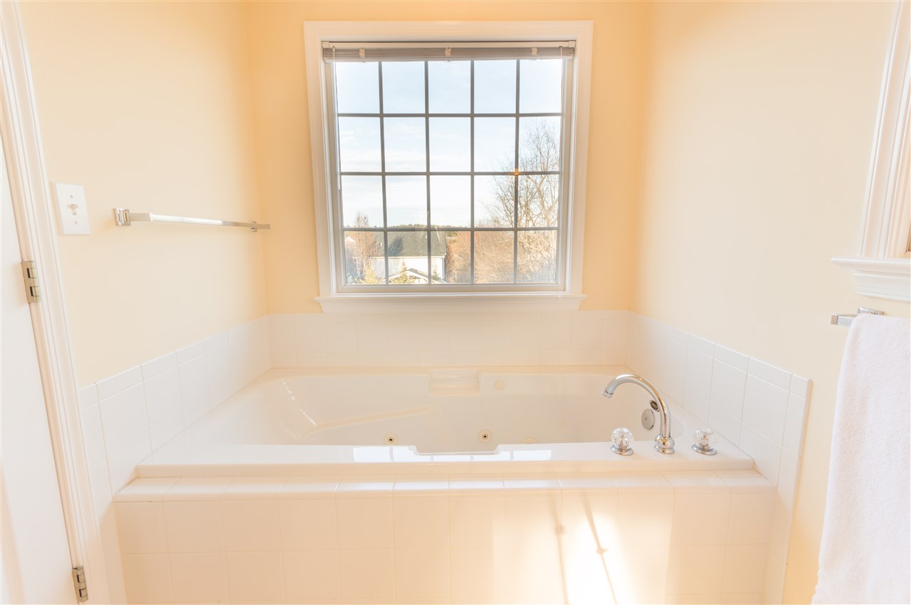 18 King Richard Road Waynesboro, VA 22980 - Photo 24 of 31 a white bath tub sitting next to a window