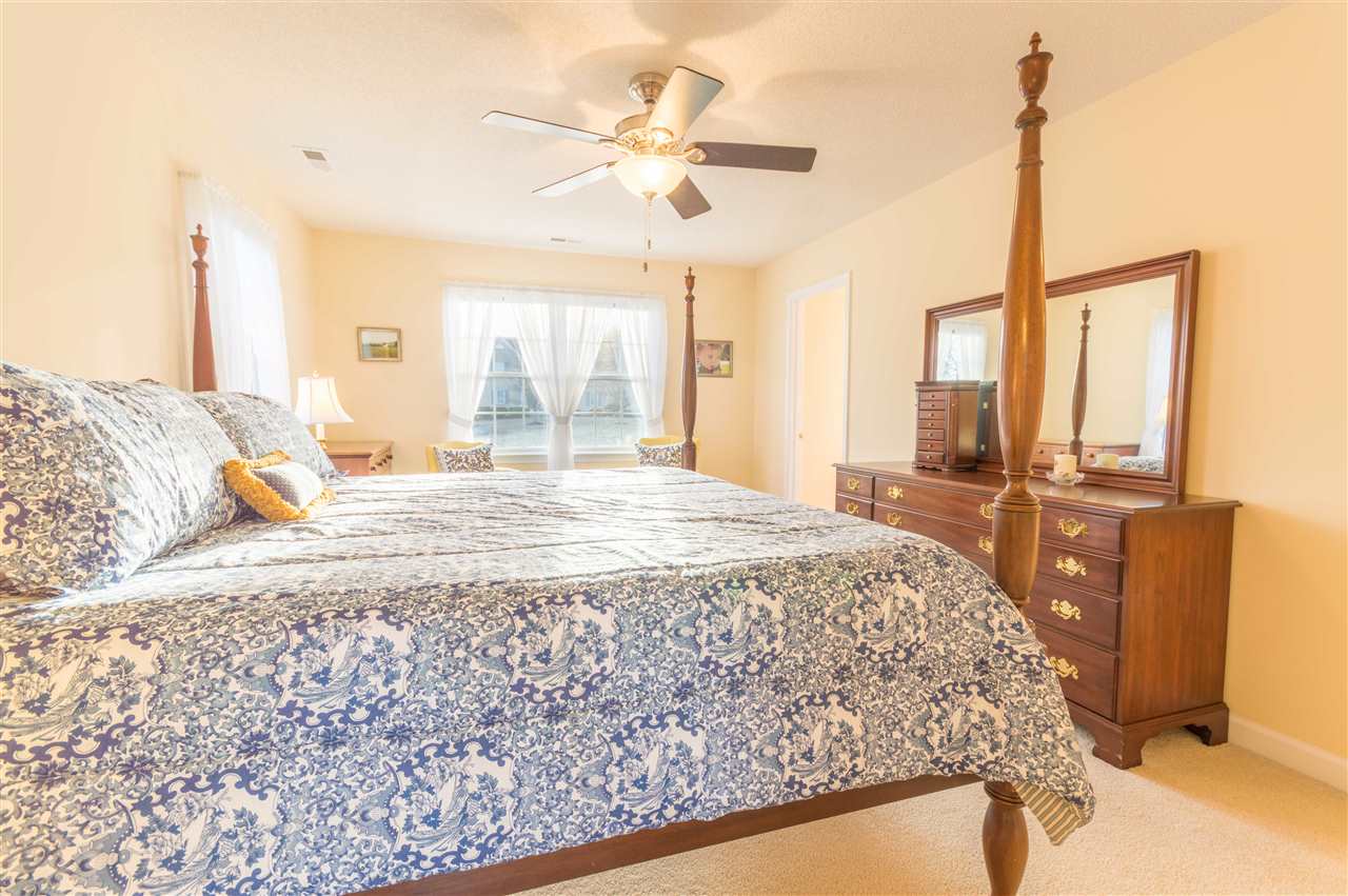 18 King Richard Road Waynesboro, VA 22980 - Photo 25 of 31 a bedroom with a bed window and a chandelier