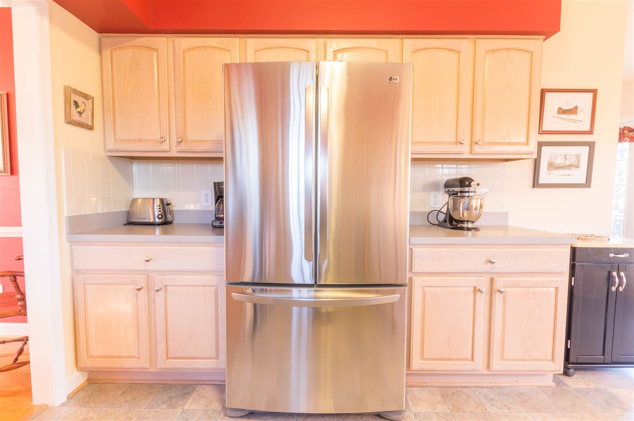 18 King Richard Road Waynesboro, VA 22980 - Photo 7 of 31 a kitchen with a refrigerator and cabinets