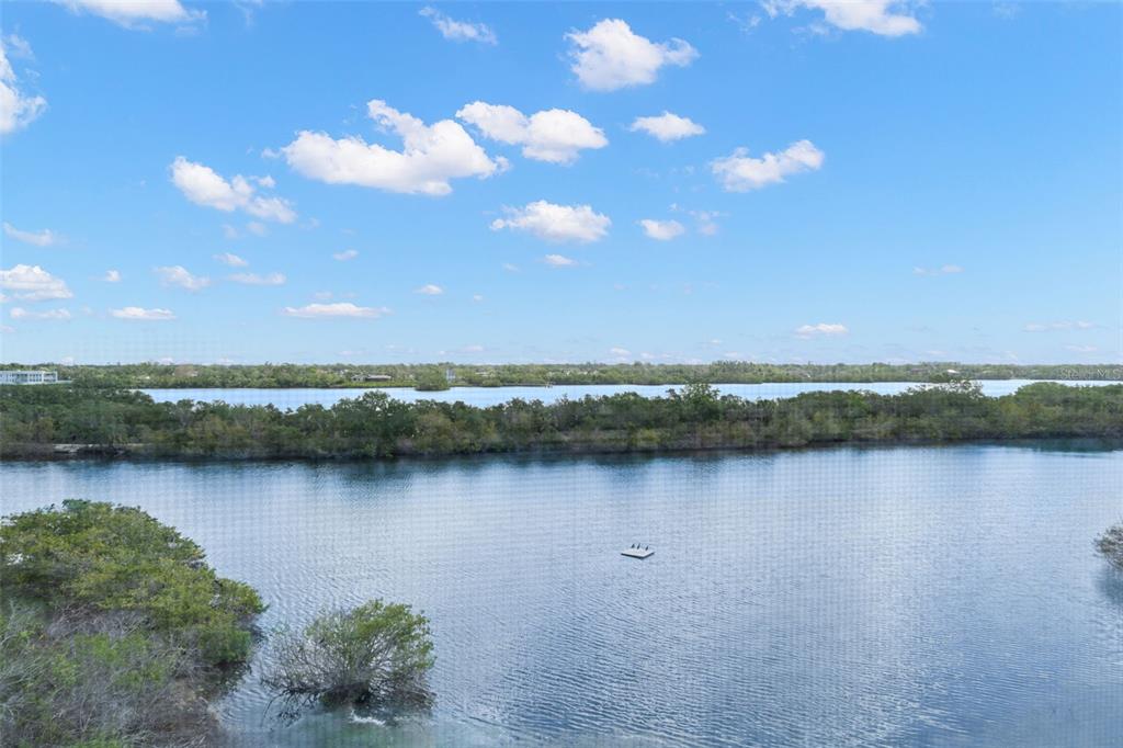 6475 Shoreline Drive, Unit 5403 St. Petersburg, FL 33708 - Photo 12 of 46 a view of a lake with a mountain