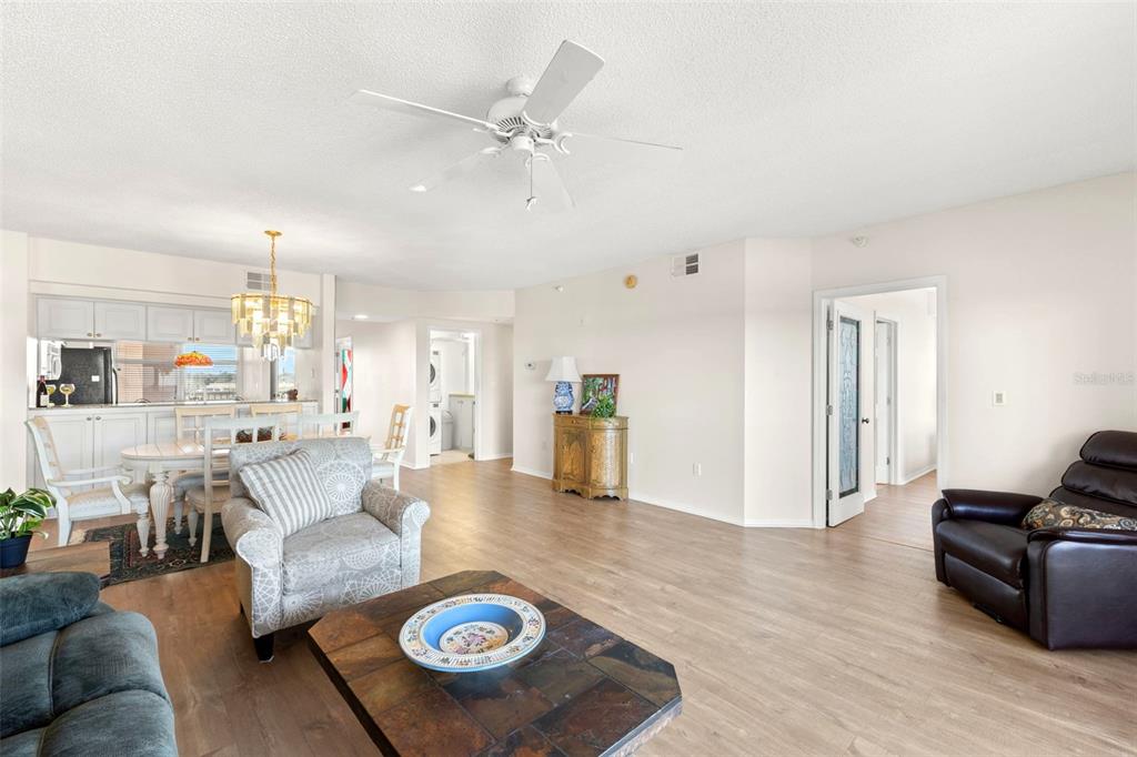 6475 Shoreline Drive, Unit 5403 St. Petersburg, FL 33708 - Photo 13 of 46 a living room with furniture and kitchen view