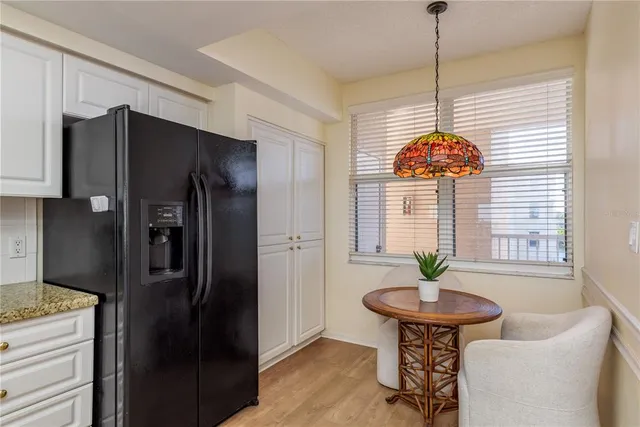 a bedroom with a large bed and a large window