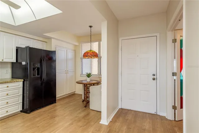 a bedroom with a bed and a potted plant