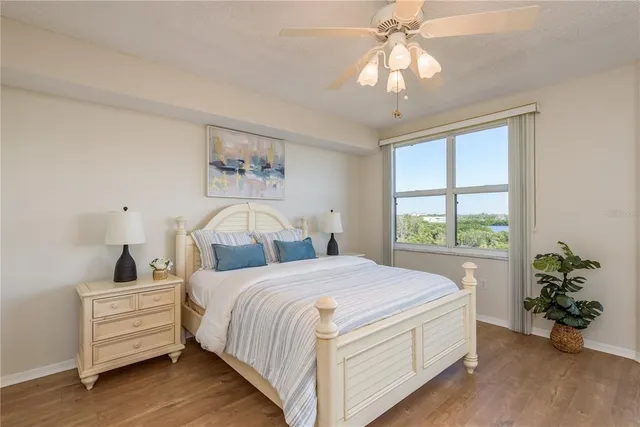 a bathroom with a granite countertop sink a mirror and a shower